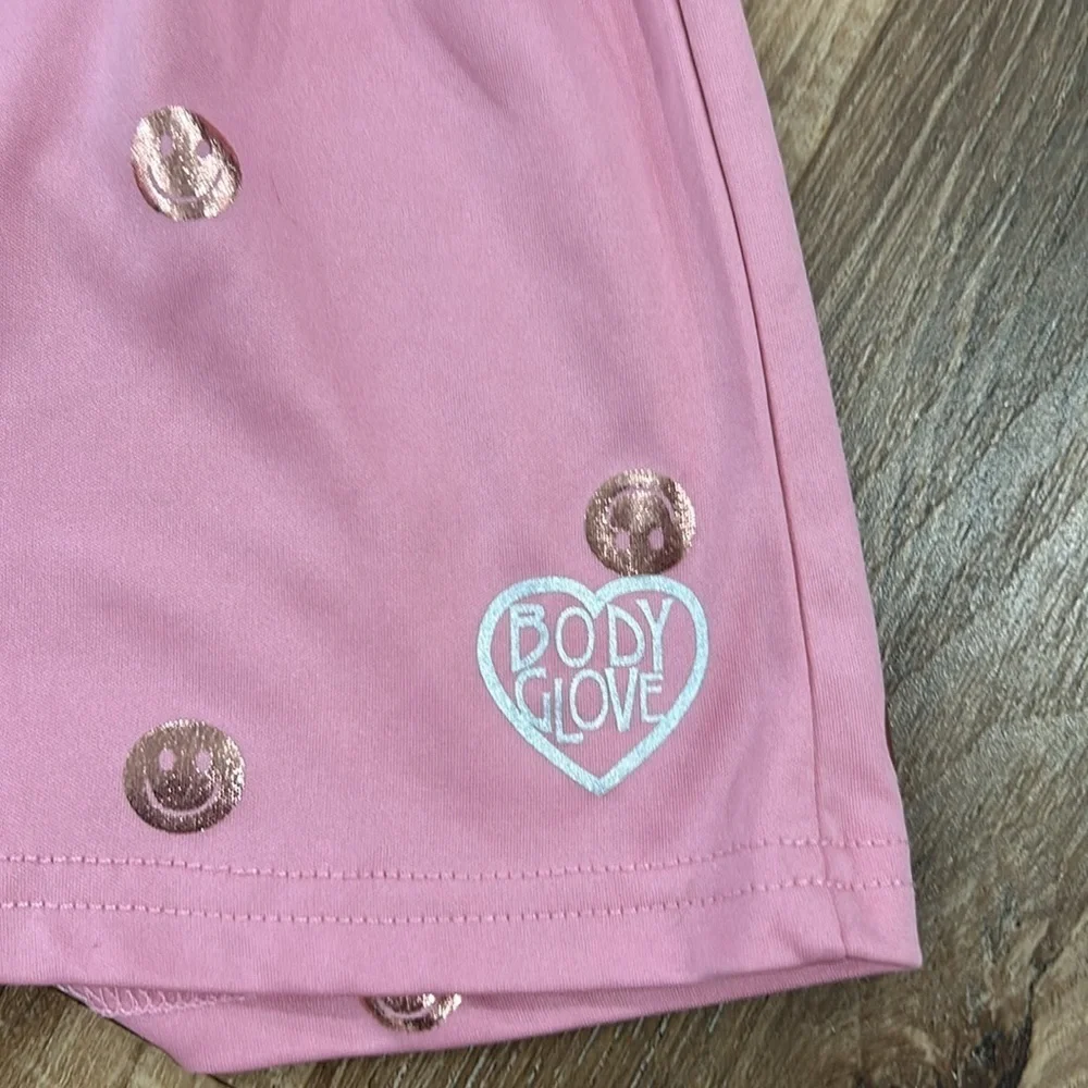 Body glove romper smiley face pink with gold smiles. Size 7 Sleeveless